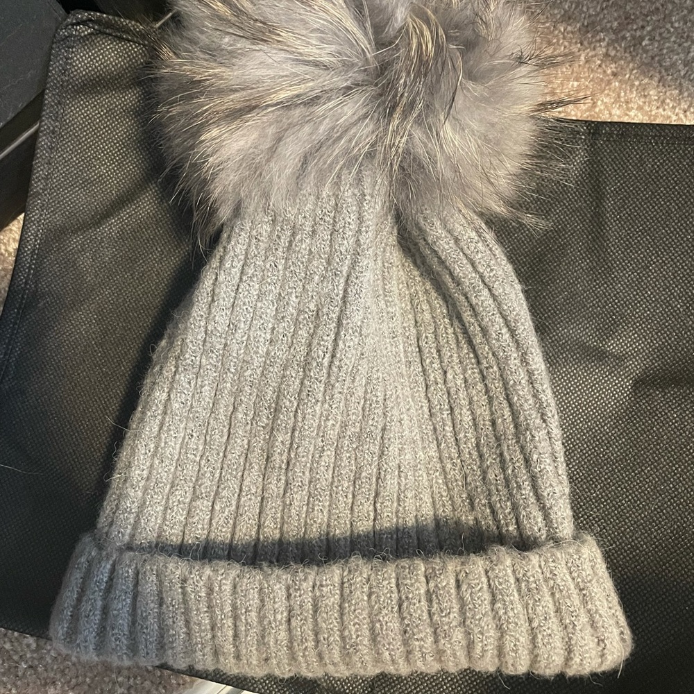 Hat with fur pom pom